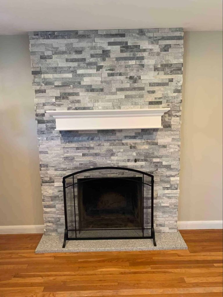 white stacked stone fireplace