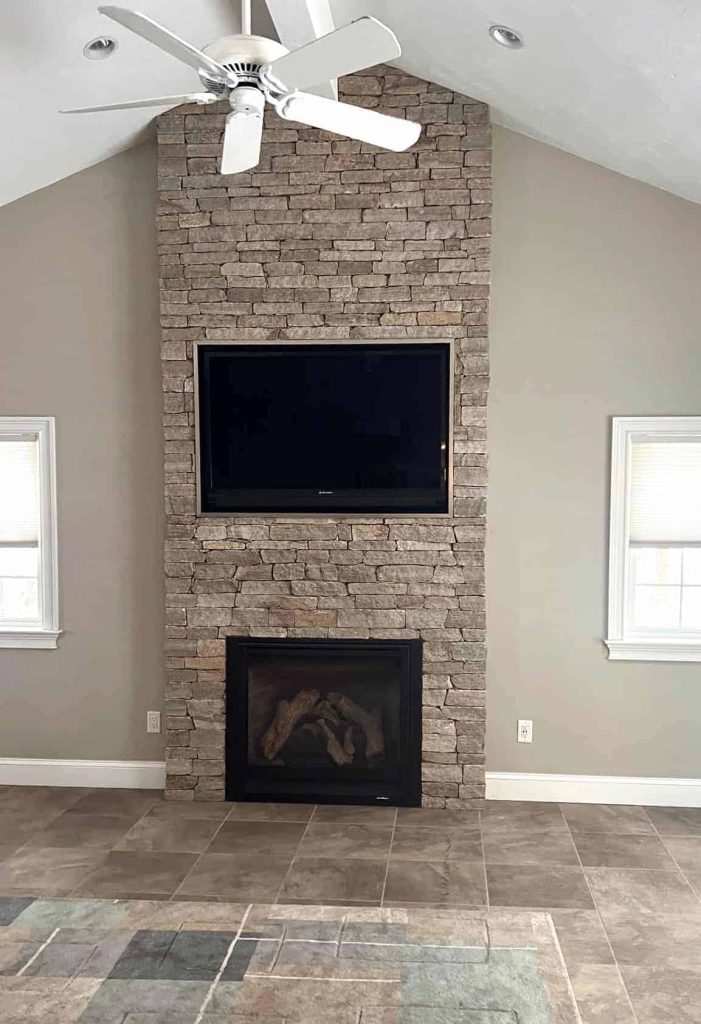 white stacked stone fireplace