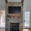Boston Blend Round Stone Fireplace by BD Remodeling