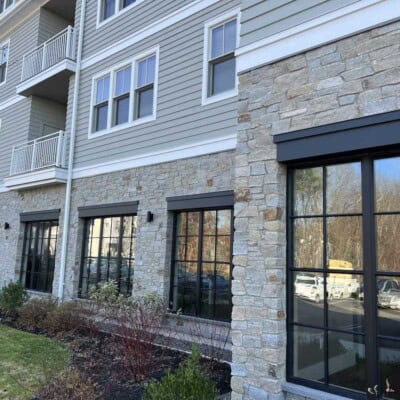 Aura Apartments by Chris Crimi Masonry - Newport Mist Ashlar and Boston Blend Ledgestone