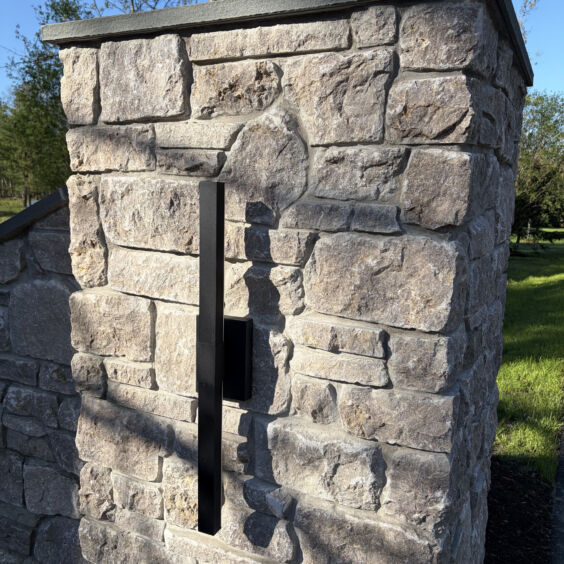 Austin Rustic Ashlar Pillar Detail Detail of Austin Rustic Ashlar thin stone veneer showing sawn ashlar pattern and natural color blend on a residential entrance pillar.
