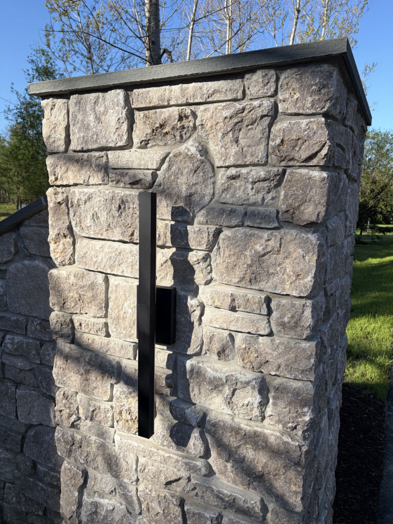 Detail of Austin Rustic Ashlar thin stone veneer showing sawn ashlar pattern and natural color blend on a residential entrance pillar.