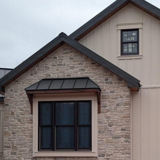Grayson Stacked Stone Thin Veneer Home Exterior Siding Grayson Stacked Stone thin veneer limestone installed as home exterior siding and porch columns on a transitional farmhouse