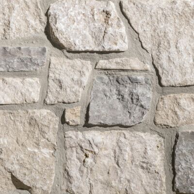 Grayson Rustic Ashlar thin veneer limestone close-up showing cream, beige, and grey tones with mortar joints