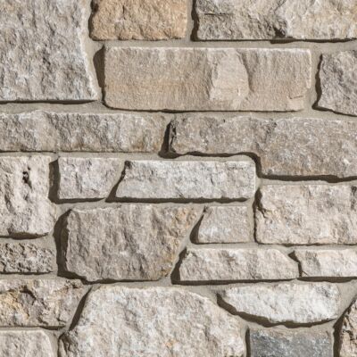 Grayson Stacked Stone thin veneer limestone close-up showing cream, beige, and grey tones with mortar joints