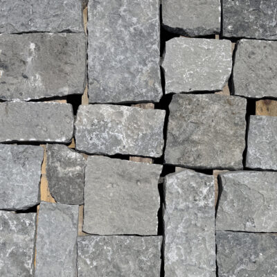 Aspen Ridge Sq & Rec thin veneer limestone close-up showing large square and rectangular pieces in cool grey tones with natural split faces