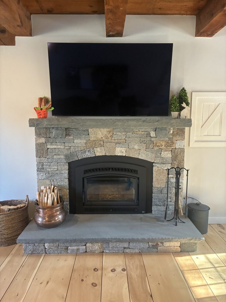 Floor-to-ceiling natural stone fireplace built with Boston Blend Square & Rectangular ledgestone veneer, installed by R Agocs Masonry of Groveland, MA.