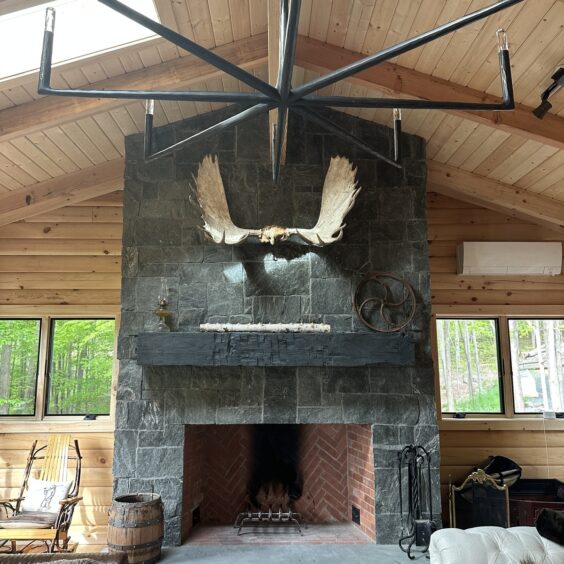 Monadnock Square Rectangular Fireplace D Paoletti 01 Floor-to-ceiling Monadnock Square & Rectangular thin stone veneer fireplace in dark gray-green quartzite, set in a vaulted log cabin great room.