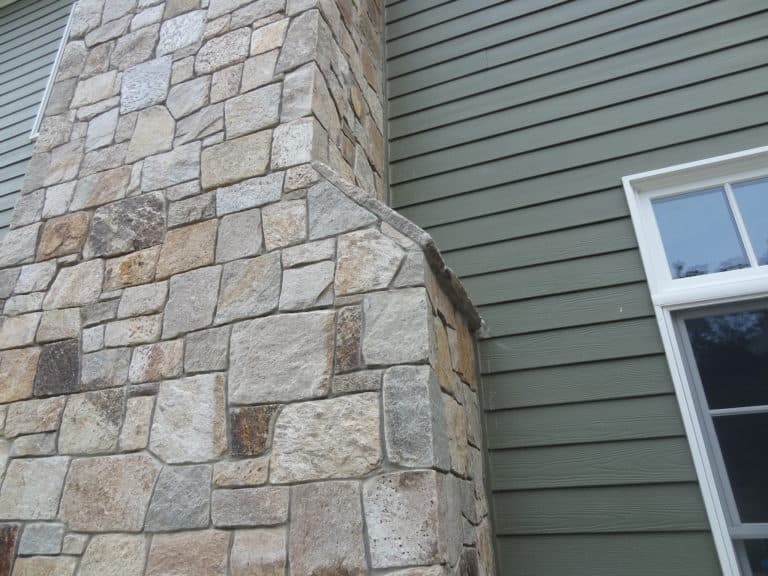 Green Siding House With Stone Accents - Stoneyard®